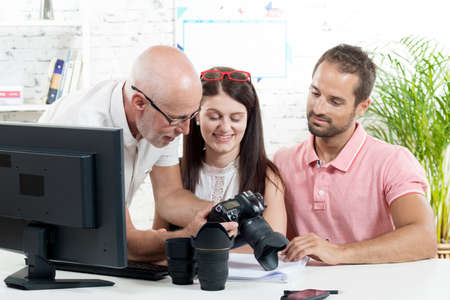 a group of photographers in their officeの写真素材