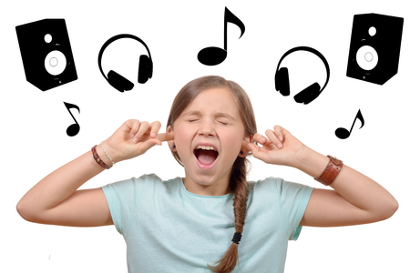 girl covering her ears,to say stop making loud noise giving me headache on white backgroundの写真素材