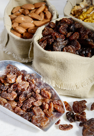 a assortment of dried fruit in small hessian bags canvasの写真素材