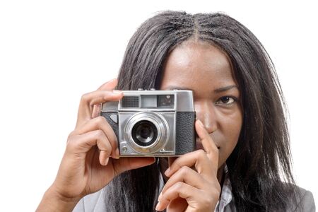 a pretty young African American with an old camera