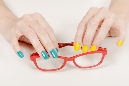 a woman hands with red glassesの写真素材