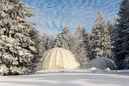 the winter landscape with white hutsの写真素材