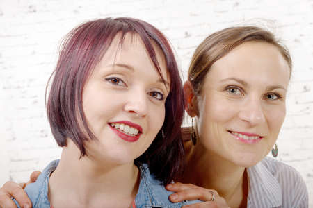a portrait of a beautiful two young women smiling