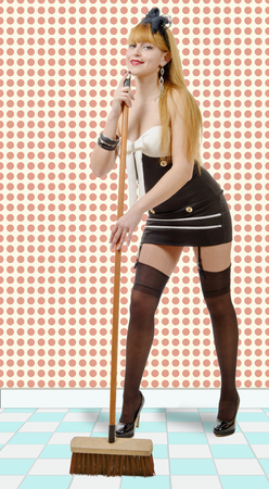 a pin-up girl with a broomの写真素材