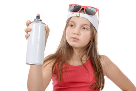 young girl with a spray can isolated on white backgroundの写真素材