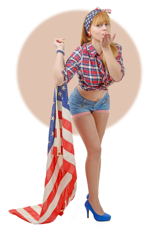 a sexy pin up girl  holding an American flag.の写真素材