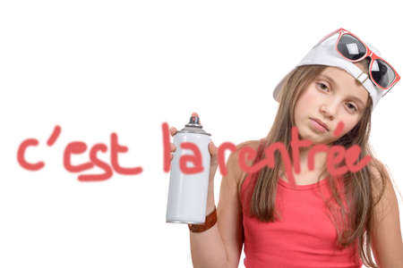 a girl writing back to school with a spray can, on white backgroundの写真素材