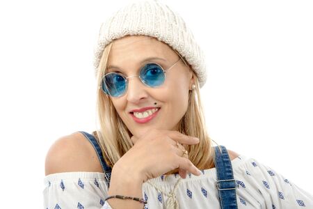 Portrait of a beautiful blond middle-aged woman with sunglassesの写真素材