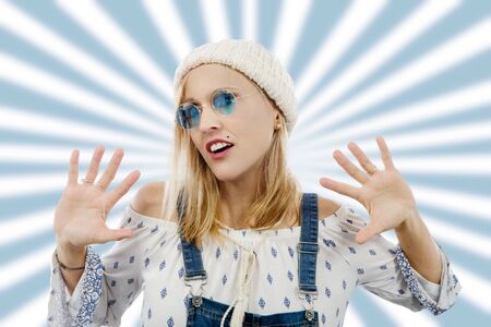 Portrait of a beautiful blond middle-aged woman with sunglassesの写真素材