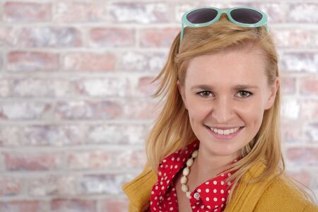 Portrait of a beautiful young blonde woman and smilingの写真素材