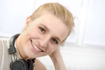 Portrait of a beautiful young blonde woman and smiling