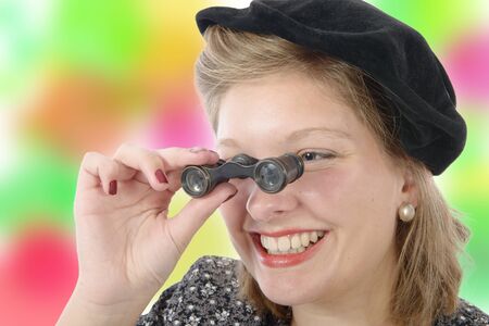 Portrait of a beautiful woman with vintage clothes and opera glasses