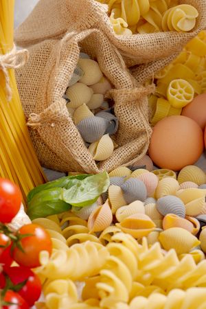 raw pastas with eggs and cherry tomatoesの写真素材