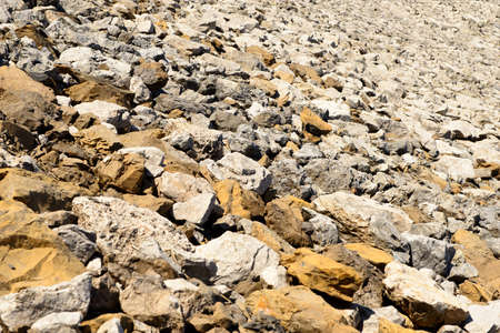 a view of lot of stones white and yellowの写真素材