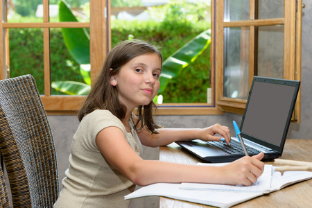 A young teenager doing her homework
