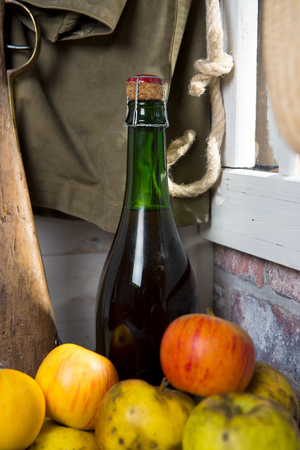 composition of organic fresh apples with a  bottle of Normandy ciderの写真素材