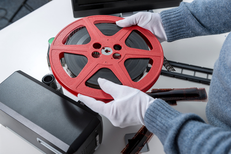 the hands man holding reel 16mm filmの写真素材