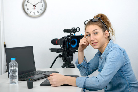 a young woman designer using graphics tablet for video editingの写真素材