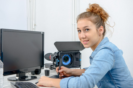 young woman designer using a graphics tablet for video editing
