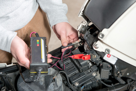 charging the battery of the motorcycleの写真素材