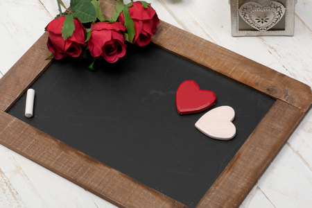 concept romantic, small chalkboard, three roses and heartの写真素材