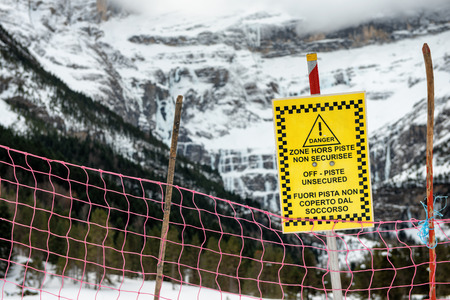 sign alerts off-piste unsecured in the french mountainsの写真素材