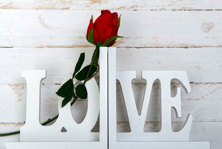 concept romantic, one rose with a wooden white love の写真素材