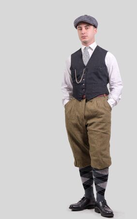 a young man in vintage clothes with hat, 1930 styleの写真素材