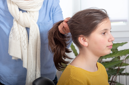 young teenager making a ponytailの写真素材