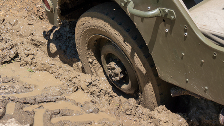 a wheel of military vehicle in the mudの写真素材