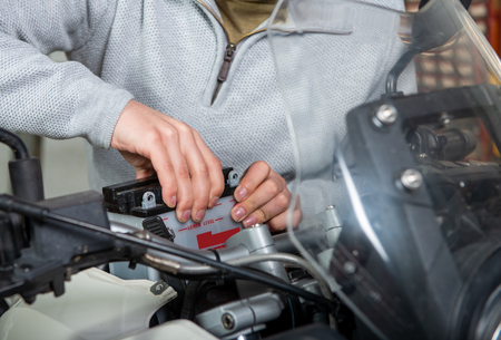 an installation of the motorbike batteryの写真素材