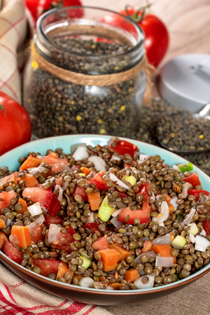 a fresh lentil salad with tomatoes and onionsの写真素材