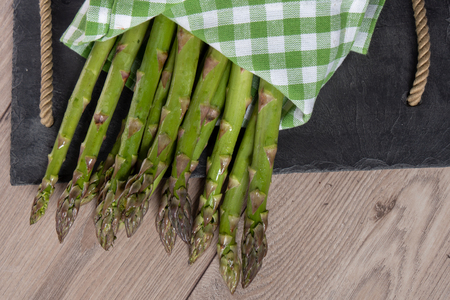 a close up of bunch of fresh asparagusの写真素材