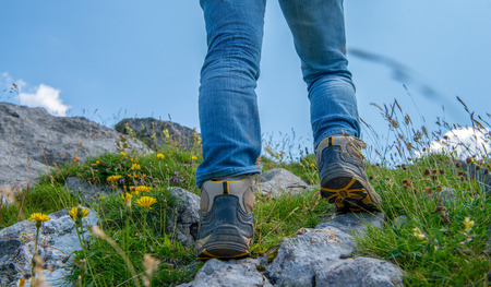 a close-up of woman hiker's foots in the mountainの写真素材