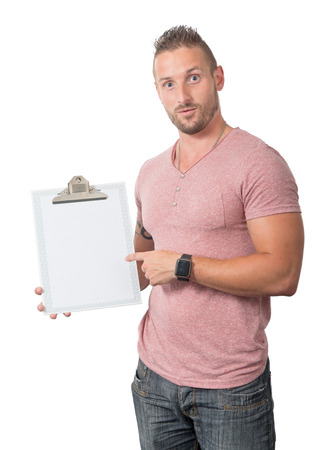 handsome young man showing a clipboard isolated on the white backgroundの写真素材