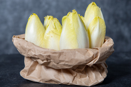 a paper bag with endives from France or Belgiumの写真素材