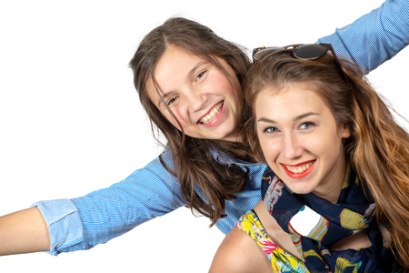 a portrait of pretty beautiful charming  adorable with long hair girl and her older friendの写真素材