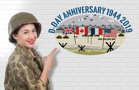 smiling young woman dressed in wwii military uniform with helmet showing signboard with d-day...