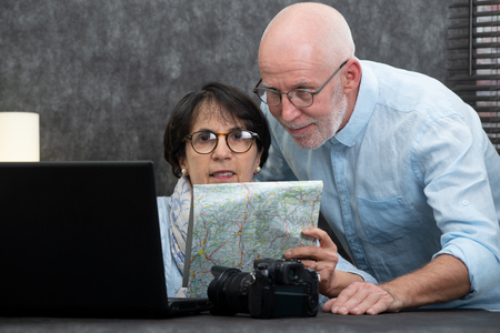 Senior couple preparing a vacation tripの写真素材