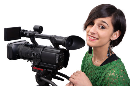 smiling young woman with professional video camera, isolated on white backgroundの写真素材
