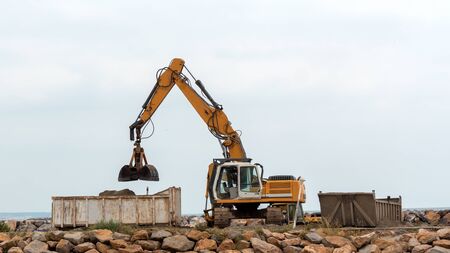 industrial excavator working on a  construction siteの写真素材