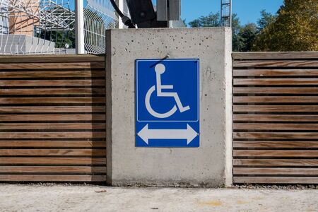a slope way sign for wheelchair peopleの写真素材