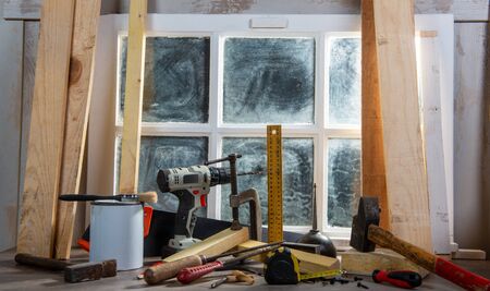 some tools of carpenter in the workshop, near the windowの写真素材