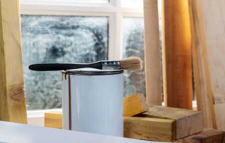 Pot of paint and paintbrushの写真素材