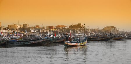 Fishing boats in the Senegal, called pirogue or piragua or piragaの写真素材