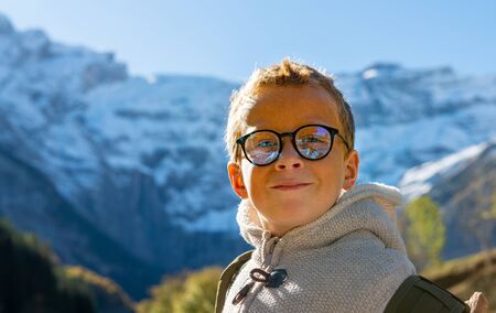 Portrait of a young child in the mountainの写真素材