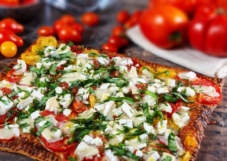 delicious vegetarian homemade pizza with tomatoes and cheese