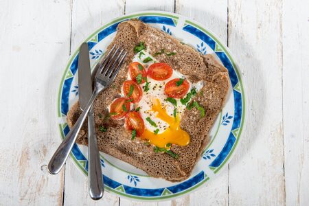 aa Breton crepe with egg and tomatoesの写真素材