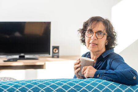 a portrait of a beautiful brunette senior woman