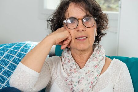 a portrait of a beautiful brunette senior woman
